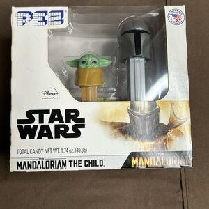 Baby Yoda with Mandalorian Pez Dispenser with candy. Brand new never opened.